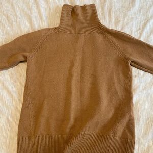 A baton turtleneck